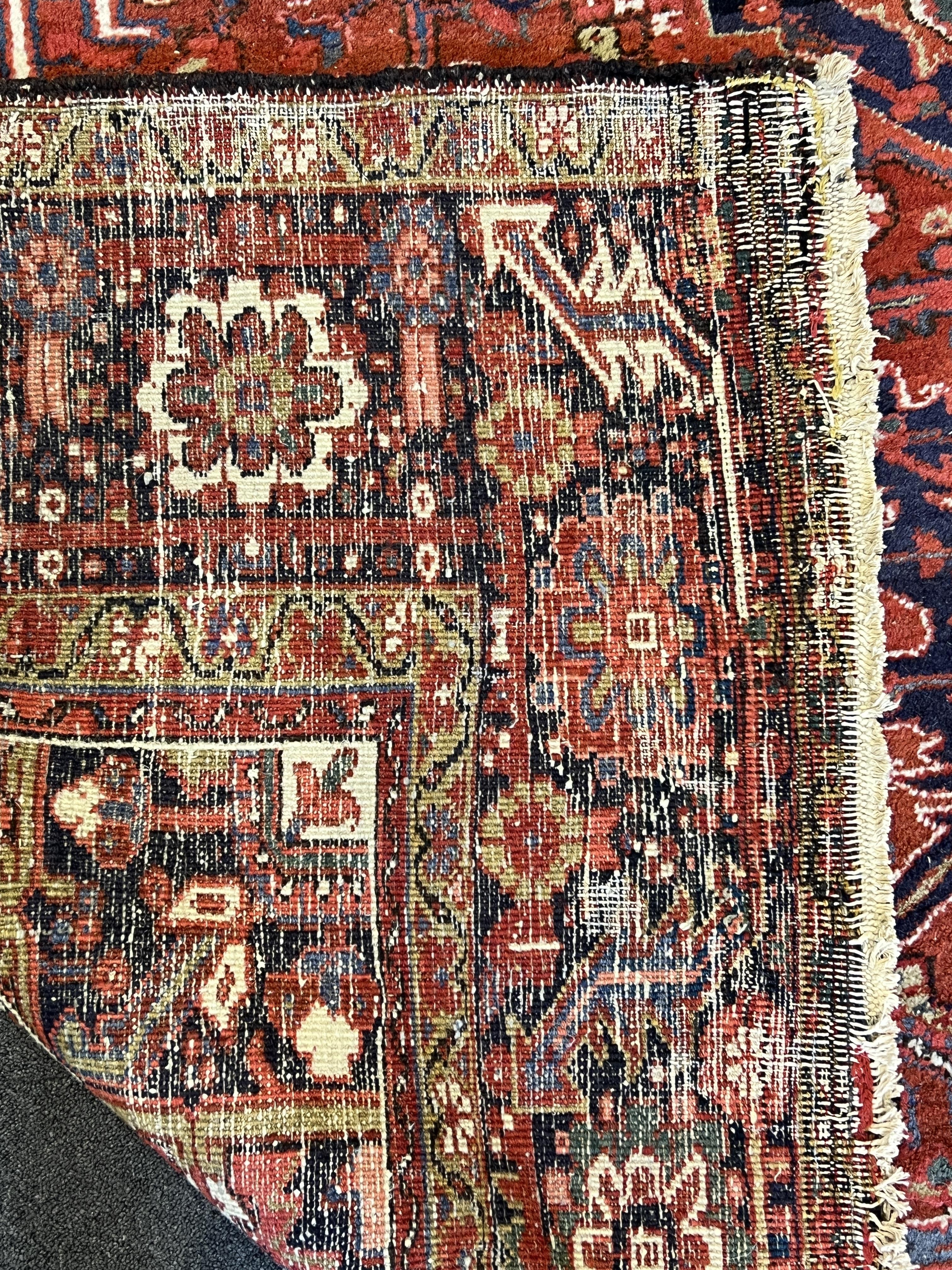 An antique Heriz carpet, 410 x 295cm